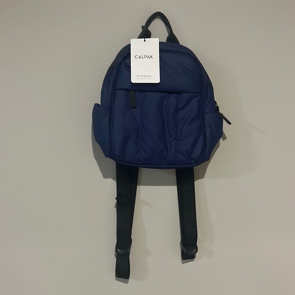 Calpak Handbags - New With Tags! Mini Navy Luca Calpak Backpack